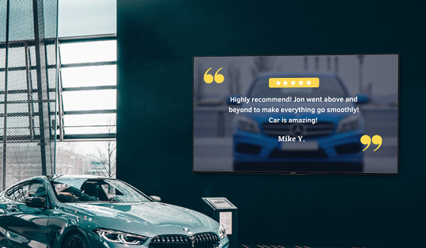 A car dealership signage placed right next to a green BMW shows customer testimonial endorsing the showroom's service.