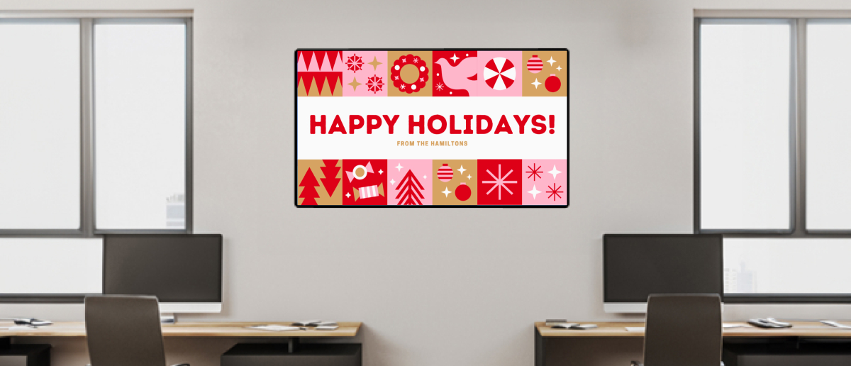 An office digital signage screen showing holiday message to employees