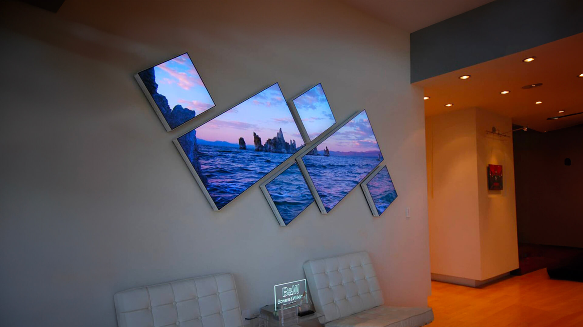 Asymmetric video wall showcasing serene nature in a hotel lobby.