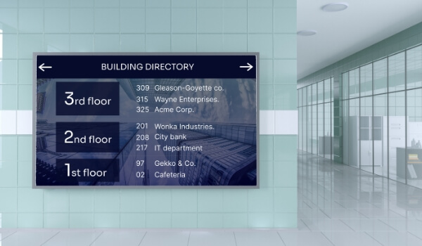 A large wall-mount digital directory board shows the office names on the 1st, 2nd & 3rd floors of a building