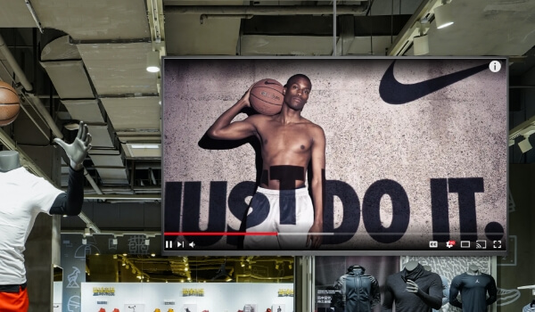 a sports clothing store playing their brand video from youtube on digital signage screen